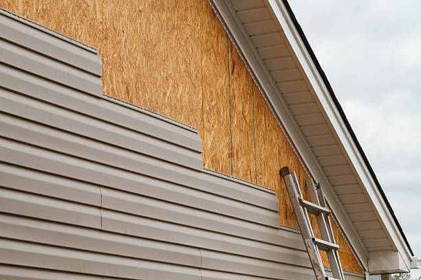 Professional Storm Damage Siding Repair technician working in Lawrence, PA